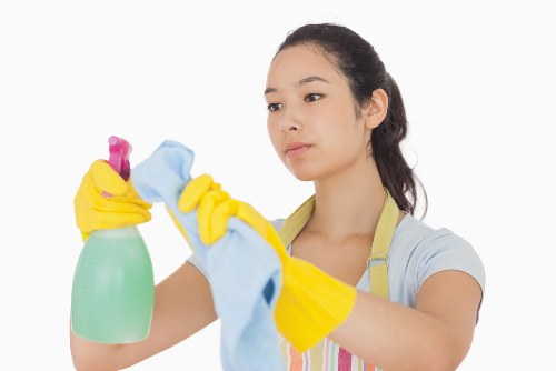 Professional carpet cleaning specialist in Pimlico treating a carpet stain