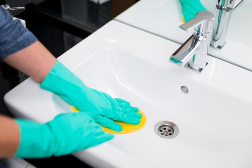 Local sofa cleaning technician treating fabric upholstery in Pimlico